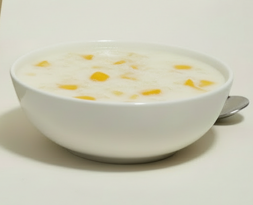 Vegan friendly mango sticky rice dessert mix by Siocolat, showing prepared sticky rice with mango slices on top.