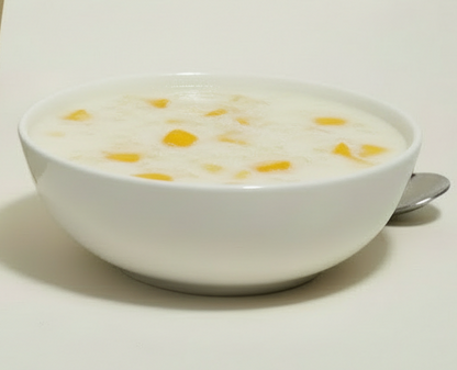 Vegan friendly mango sticky rice dessert mix by Siocolat, showing prepared sticky rice with mango slices on top.