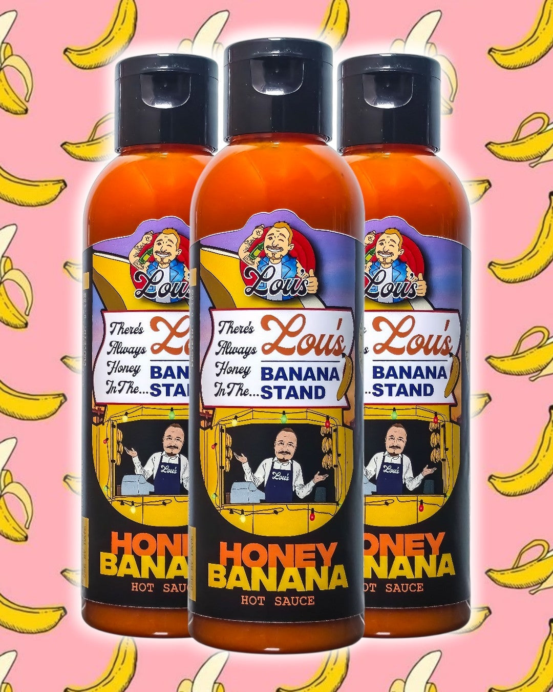 Bottle of Lou's Brews There's Always Honey In The Banana Stand banana and honey sauce, a sweet condiment in a clear glass bottle.