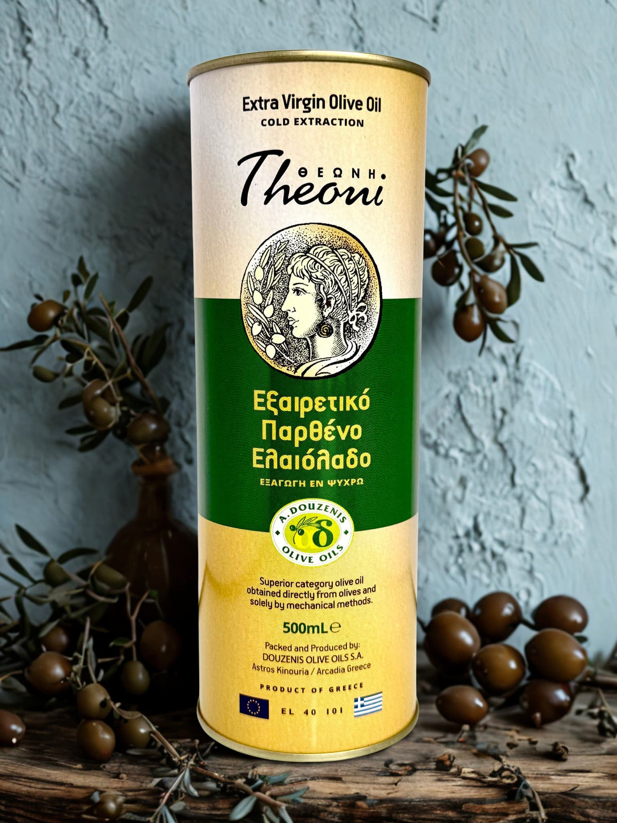 Theoni Extra Virgin Olive Oil 500ml bottle from The Greek Deli Club, with a clear label and green cap, on a wooden surface.