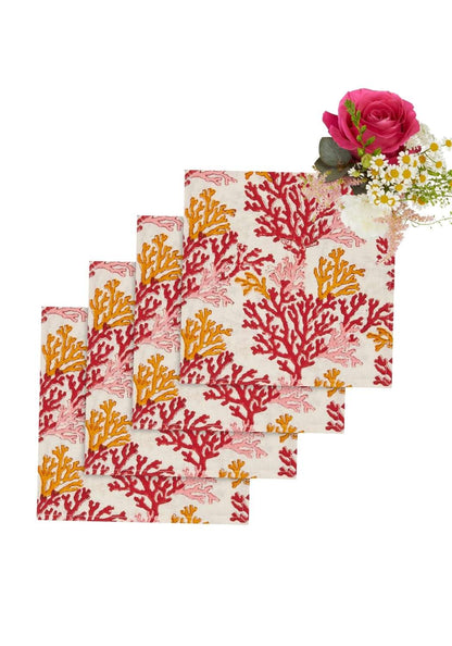 Set of four rose coral Casa by Josephine Jenno table napkins with elegant, soft fabric design for dining or decoration.