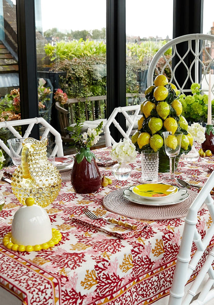 Set of four Rose Coral table napkins by Casa by Josephine Jenno, featuring vibrant floral design for elegant dining.