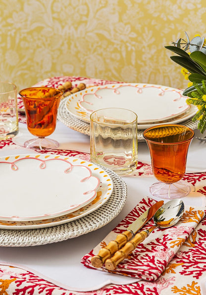 Set of four rose coral fabric table napkins by Casa by Josephine Jenno, soft and elegant for dining decor.