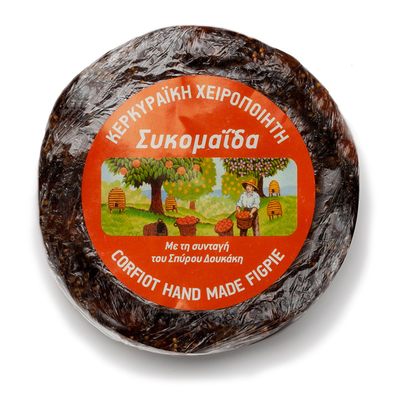 Round handmade fig pie from Corfu, a delicious Greek fig snack with a golden crust and visible fig filling.