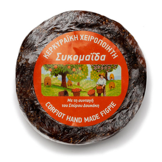 Round handmade fig pie from Corfu, a delicious Greek fig snack with a golden crust and visible fig filling.
