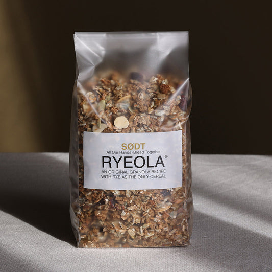 Bag of Ryeola granola with a label on a gray surface