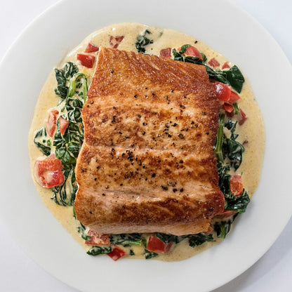 Salmon seasoning rub by GOODNESS IN A BOWL, featuring a blend of herbs and spices for flavorful seafood preparation.