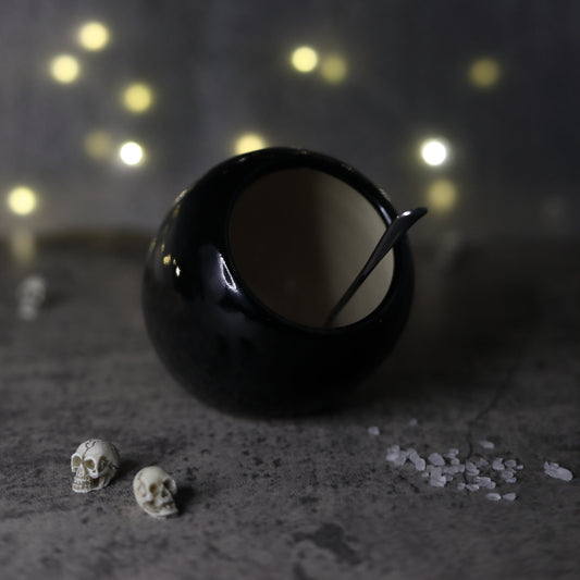Jet black classic salt pig by Katie L Thompson Designs with a smooth, rounded ceramic body and open top for easy salt access.