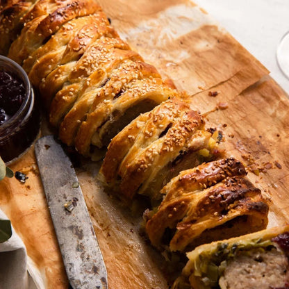 Raw pork sausage meat plait from Primrose Herd, showcasing fresh, seasoned sausage meat ready for cooking.