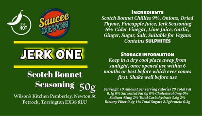 Wilson’s Kitchen Jerk Scotch Bonnet Seasoning in a jar, artisan chili sauce with vibrant red Scotch bonnet peppers and spices.