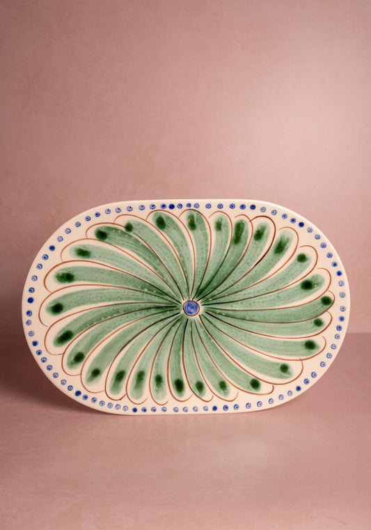 Green ceramic Peacock serving plate by Casa by Josephine Jenno, decorative serving piece with intricate peacock design.