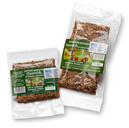 Sesame snack bars with honey from The Greek Deli Club, showing multiple packed snack bars with sesame seeds and honey drizzle.