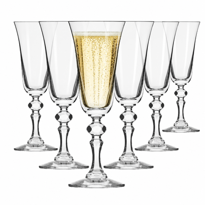 Set of six Krosno Krista champagne flute glasses, 150ml capacity, with one filled with bubbly, showcasing elegant glassware.