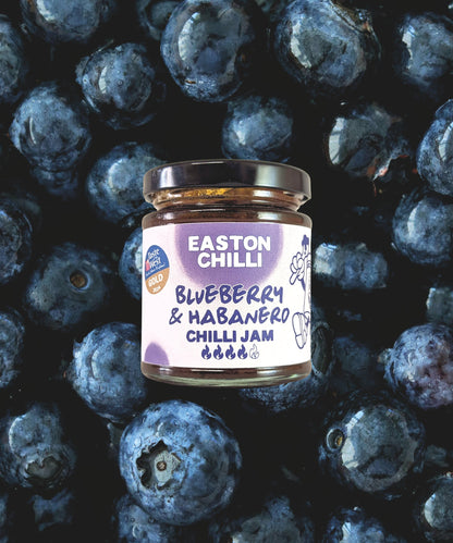 Easton Chilli Blueberry & Habanero Chilli Jam jar with vibrant label and fresh blueberries and habanero peppers.