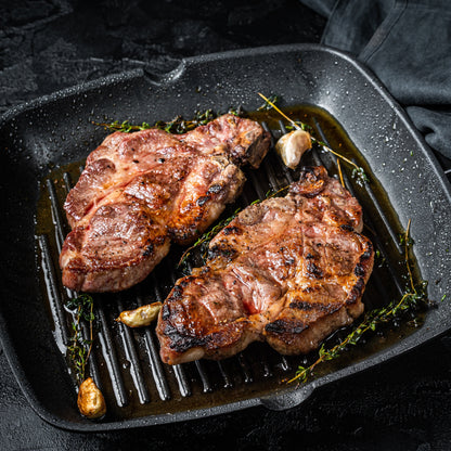 Primrose Herd pork spare rib chops, 500g, showing raw pork shoulder rib cuts with marbling and bone-in detail.