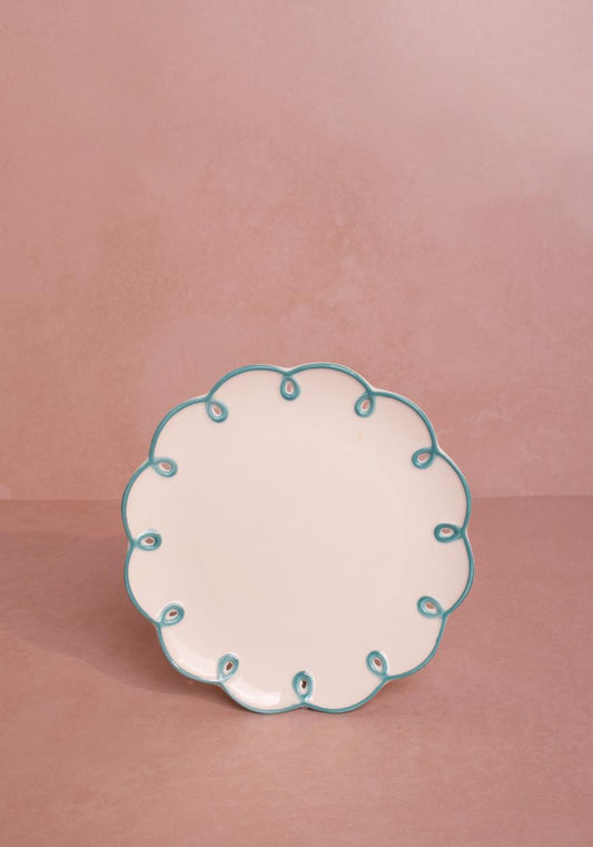 Set of four sky blue scalloped side plates by Casa, featuring elegant, decorative edges perfect for serving small dishes.