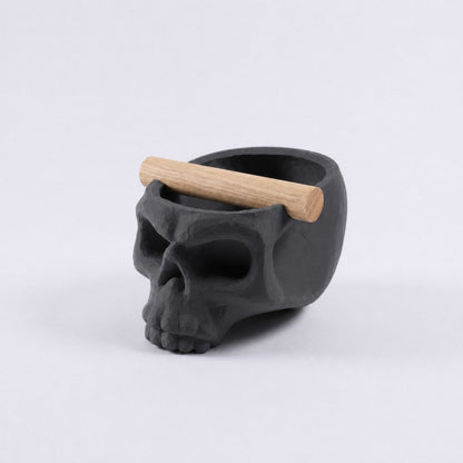 Gothic skull espresso knock box with oak bar by KNOCDIC®, featuring a charcoal finish and skull-shaped design for coffee enthusiasts.