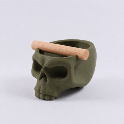Gothic skull espresso knock box with oak bar from KNOCDIC® in olive green, featuring a skull-shaped design for coffee brewing.