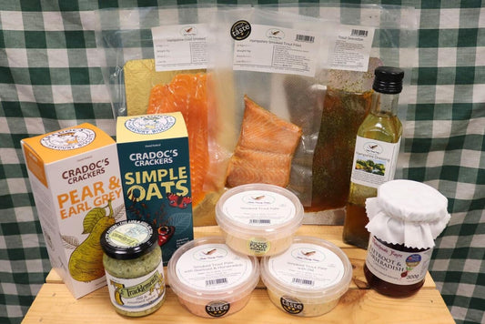 Smoked Trout Christmas Bundle by Butler Country Estates showing a selection of smoked trout fillets and festive packaging.