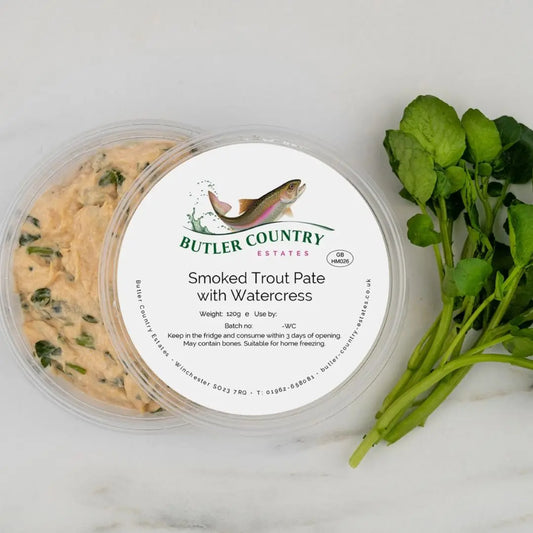 Creamy smoked trout pate with watercress on a plate, ready to serve, from Butler Country Estates.