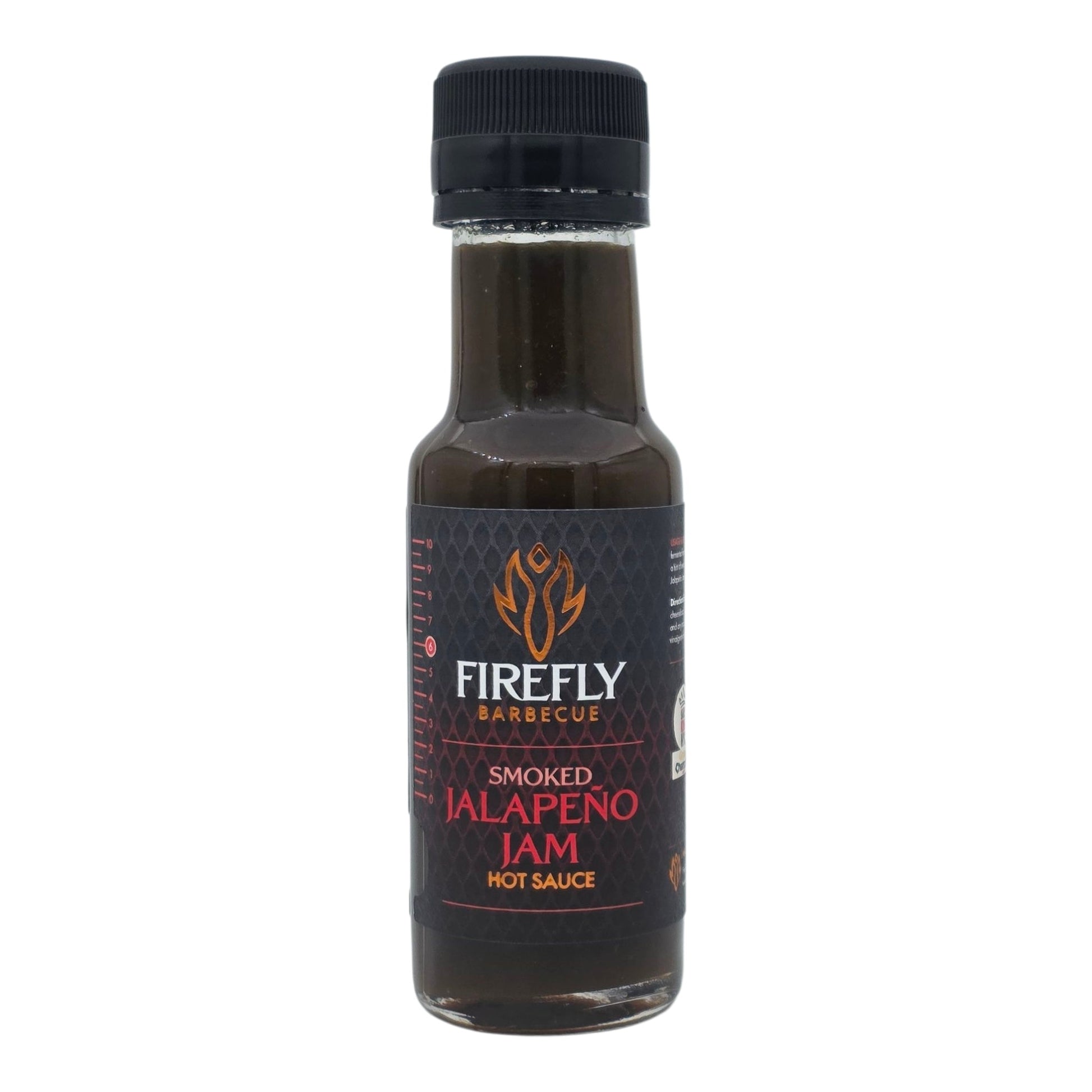 Spicy smoked jalapeño jam in a jar, featuring vibrant green jalapeños and rich smoky texture, ideal as a hot sauce or condiment.