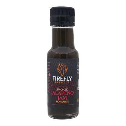 Spicy smoked jalapeño jam in a jar, featuring vibrant green jalapeños and rich smoky texture, ideal as a hot sauce or condiment.