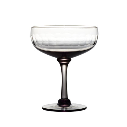 four smoky crystal cocktail glasses with lens design