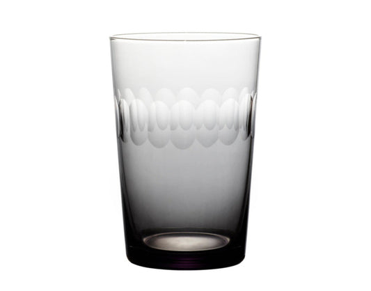 Four smoky crystal tumblers with lens design from The Vintage List, showcasing their elegant, translucent glass appearance.
