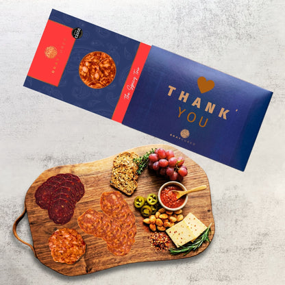 Bray Cured Spicy Tasting Trio charcuterie board featuring assorted spicy cured meats and accompaniments on a wooden platter.