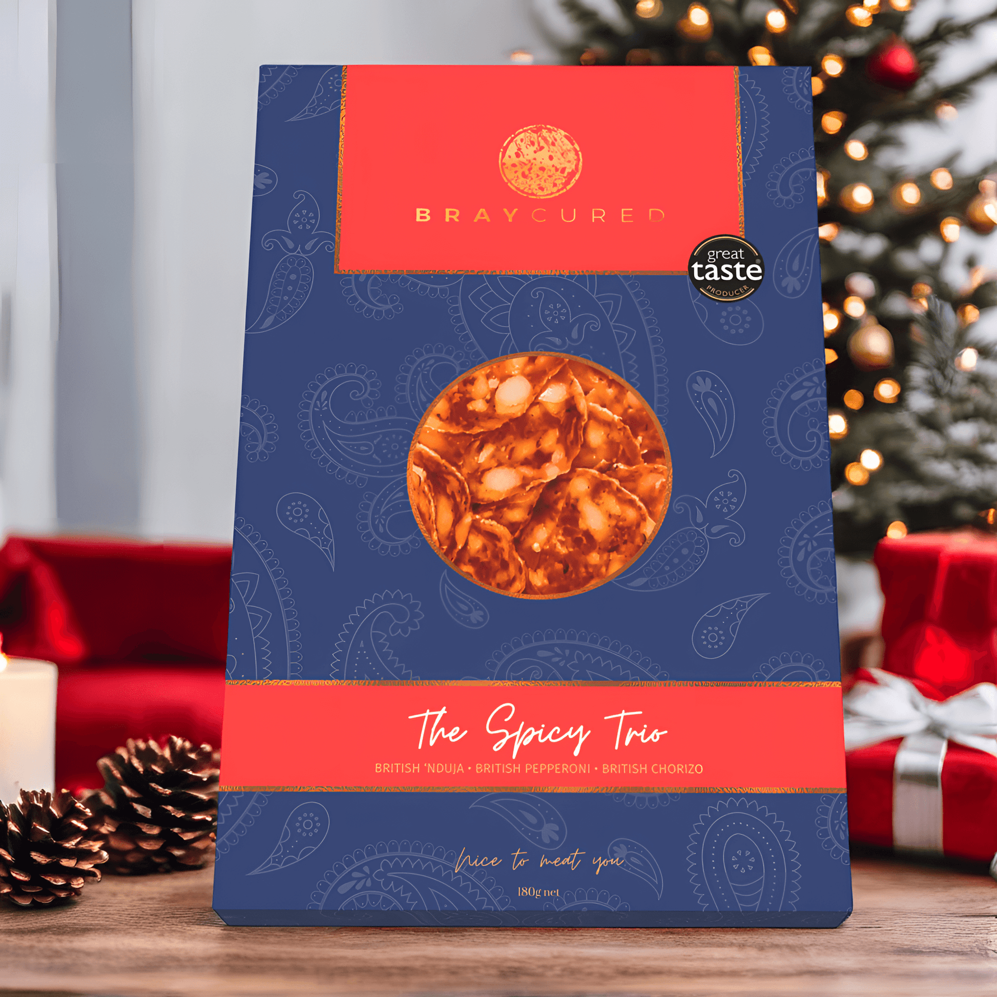 Bray Cured spicy charcuterie tasting trio with assorted cured meats and spices, displayed on a festive Christmas scene.
