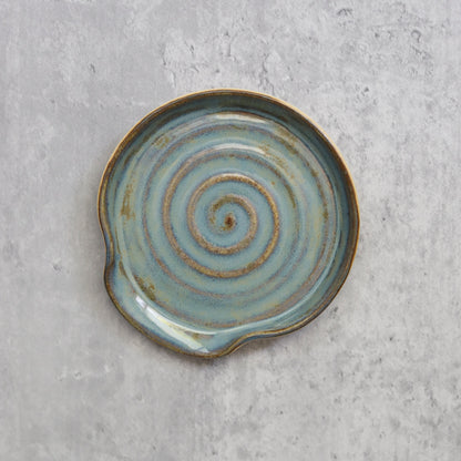 Seafoam blue classic spoon rest by Katie L Thompson Designs, flat lay showing smooth ceramic surface and functional kitchen design.