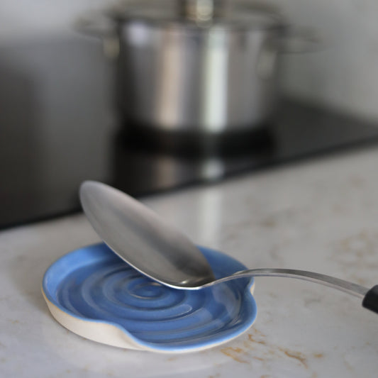 Pacific Blue ceramic spoon rest by Katie L Thompson Designs, with a classic shape and vibrant blue finish for kitchen use.
