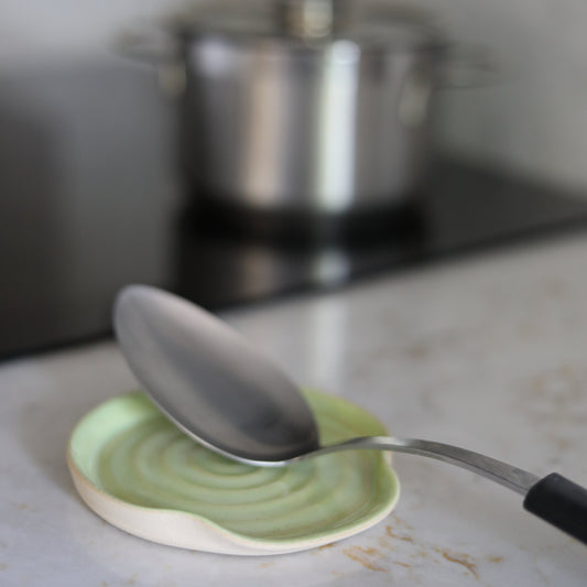 Spring green ceramic spoon rest from Katie L Thompson Designs, with a classic design perfect for kitchen use.