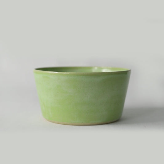 Spring green ceramic breakfast bowl by Katie L Thompson Designs, featuring a classic round shape and smooth finish.