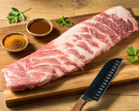 Raw St. Louis Style Pork Ribs from Primrose Herd, showcasing meaty, well-trimmed pork ribs ready for cooking.