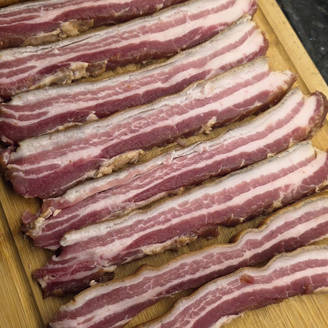 FireFly Barbecue bacon curing kit with bacon strips, curing salts, and hickory smoke flavor for homemade smoked bacon.