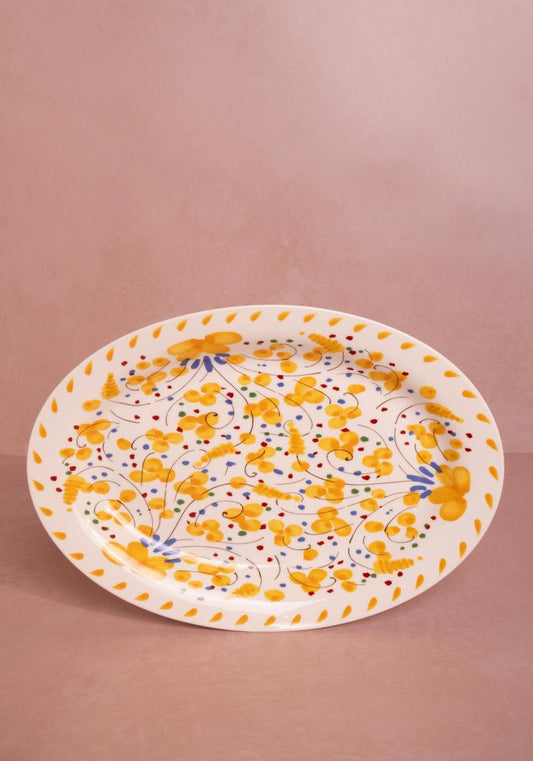 Casa by Josephine Jenno Sunshine Daisy oval serving plate with bright floral design and elegant curved edges.