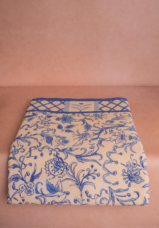 Casa by Josephine Jenno Belgravia Bloom blue cotton tablecloth spread on a dining table with floral pattern and elegant design.