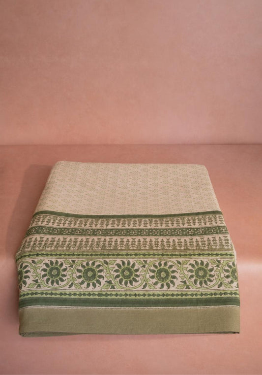 Green Dream tablecloth by Casa by Josephine Jenno, showcasing a vibrant green fabric with a smooth, elegant drape.