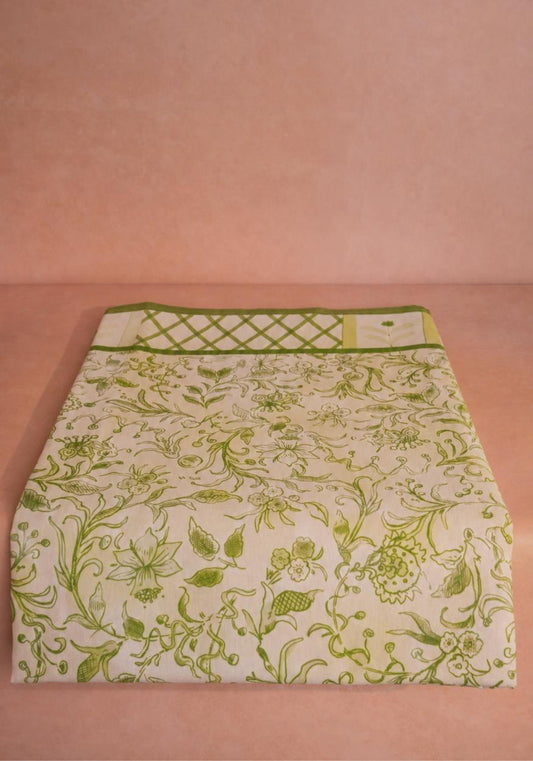 Cotton tablecloth with Pretty Meadow green floral design from Casa by Josephine Jenno, showcasing vibrant green and floral patterns.