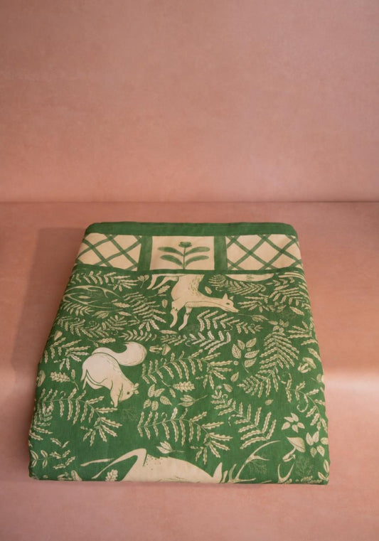 Woodland green cotton tablecloth from Casa by Josephine Jenno, showcasing a natural, elegant fabric design.
