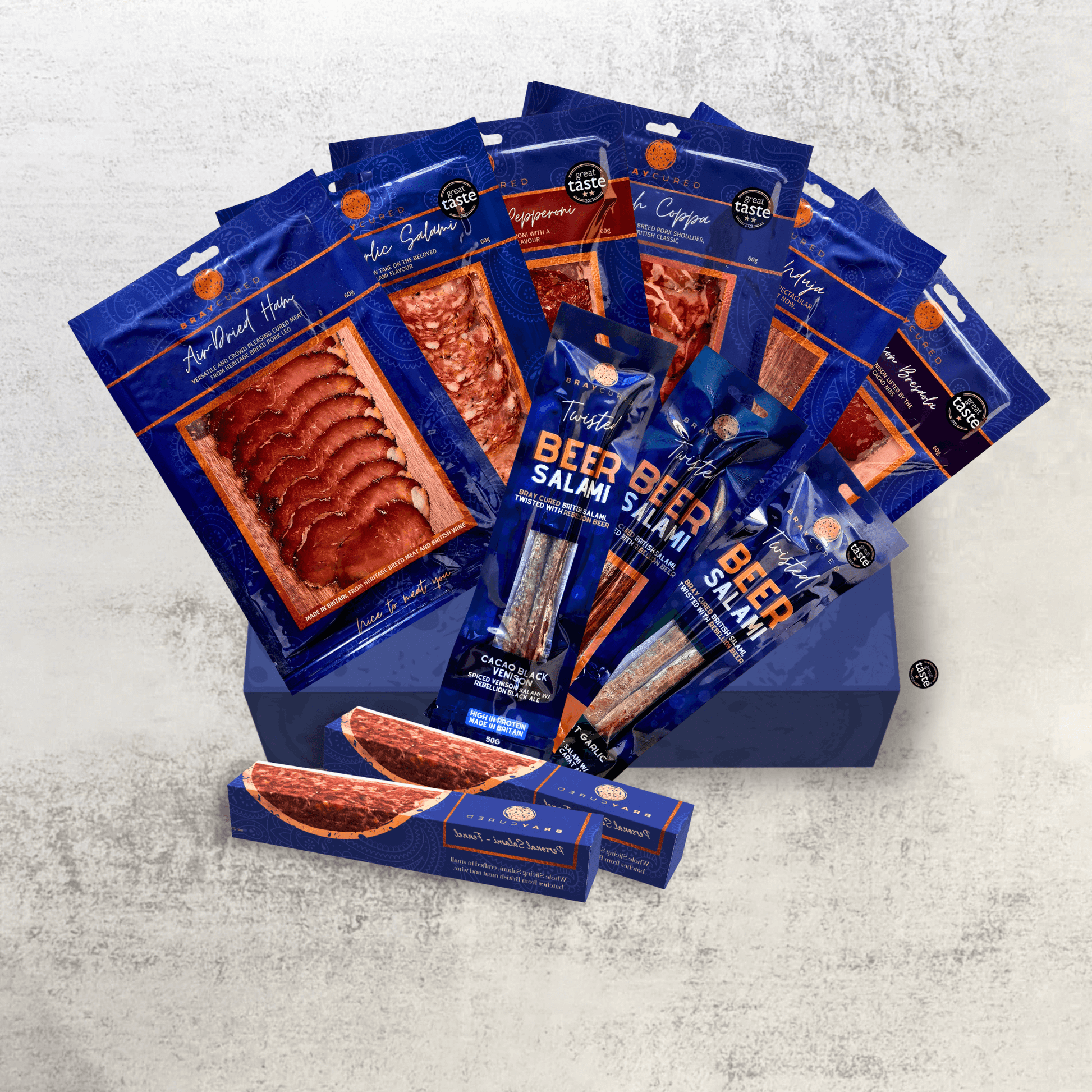 Assorted Bray Cured charcuterie selection featuring cured meats displayed on a wooden board.
