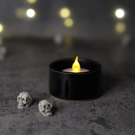 Jet black classic tea light holder from Katie L Thompson Designs, featuring a sleek, round design perfect for ambient lighting.