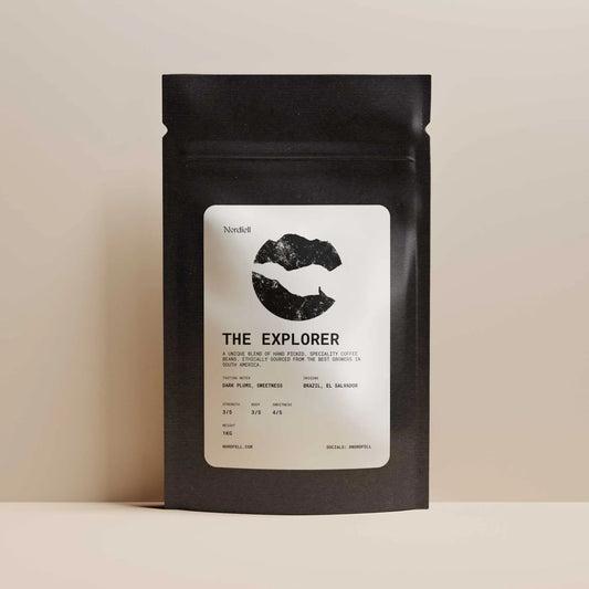 Nordfell The Explorer 1kg bag of premium coffee beans, showcasing whole beans in a natural light with a focus on product packaging.