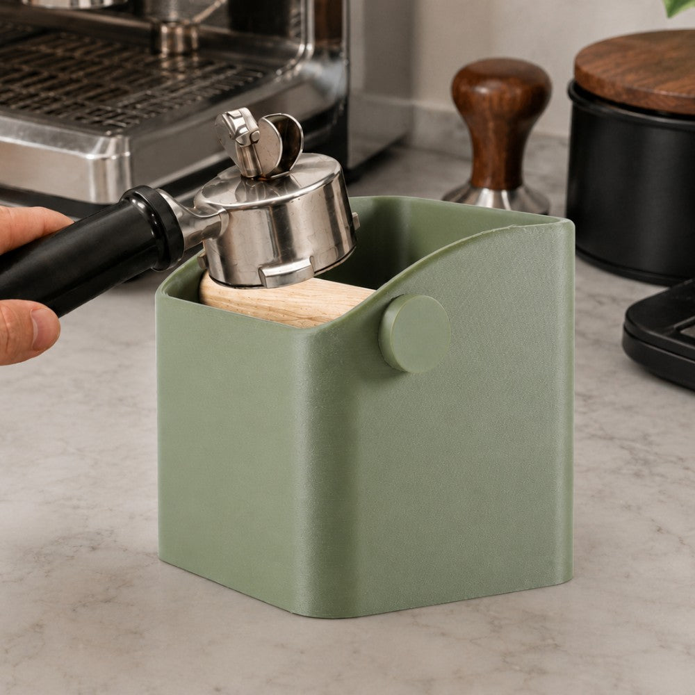 KNOCDIC® Square Espresso Knock Box with oak knock bar for barista coffee machine, in use on a countertop.