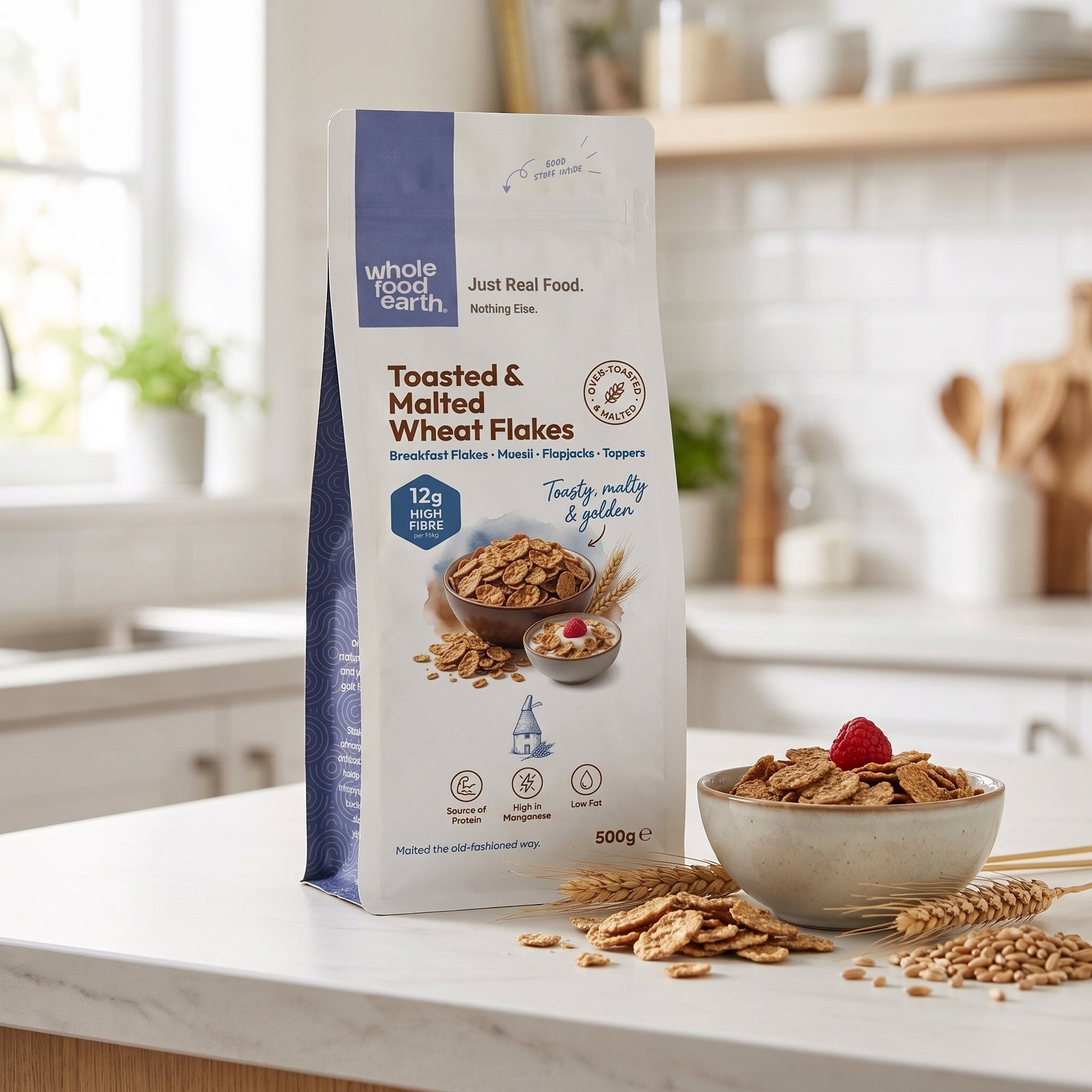 Whole Food Earth toasted and malted wheat flakes cereal in a bowl with milk, showcasing golden toasted wheat flakes.