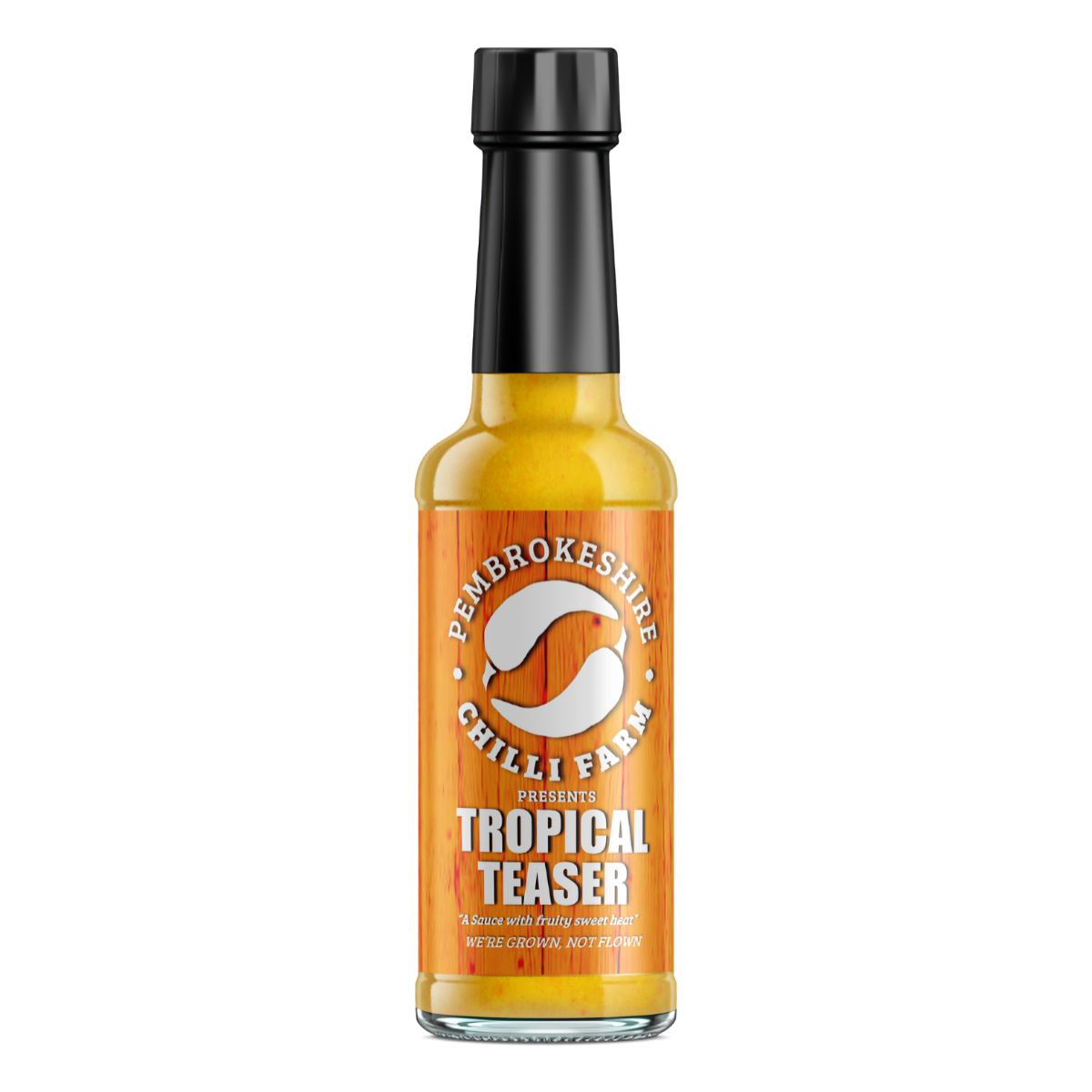 Tropical Teaser Chilli Sauce bottle from Pembrokeshire Chilli Farm with bright tropical fruit and chili ingredients visible.