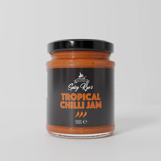 Spicy Ryes Tropical Chilli Jam jar with vibrant fruit and chili ingredients, showcasing the flavorful tropical chutney.