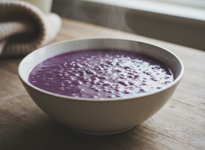 Vegan friendly no added sugar ube champorado rice porridge served in a bowl, showcasing vibrant purple sticky rice dessert by Siocolat