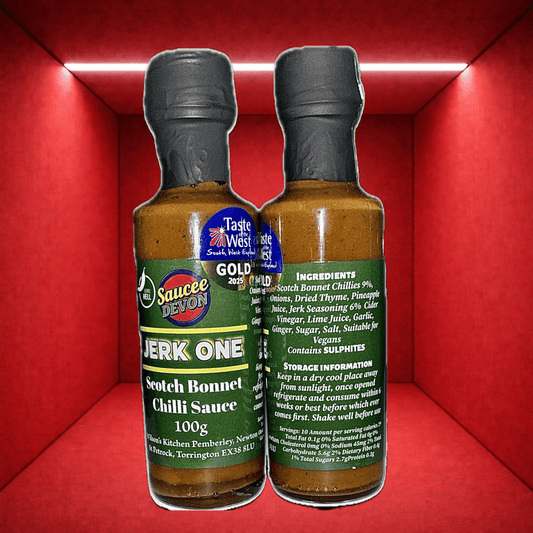 Wilson’s Kitchen Scotch Bonnet Chilli Sauce bottle, vibrant red sauce with a label, in a glass container for artisanal chili flavor.
